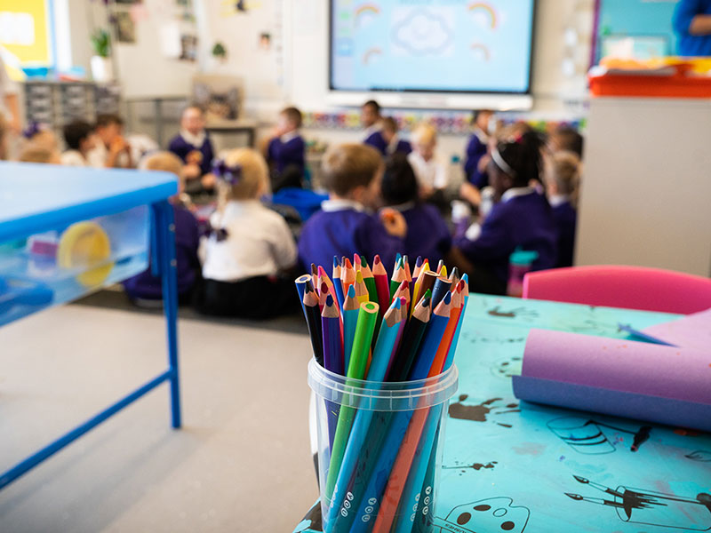 Close up of coloured pencils in classroom